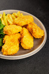 Nuggets and french fries fast food tasty snack fresh delicious gourmet food fonna on the table rustic food top view copy space