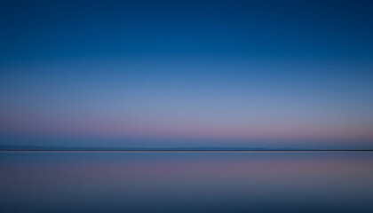 Tranquil Horizon Capturing the Calm of Sunset's Reflection on Still Water, Evoking Serenity