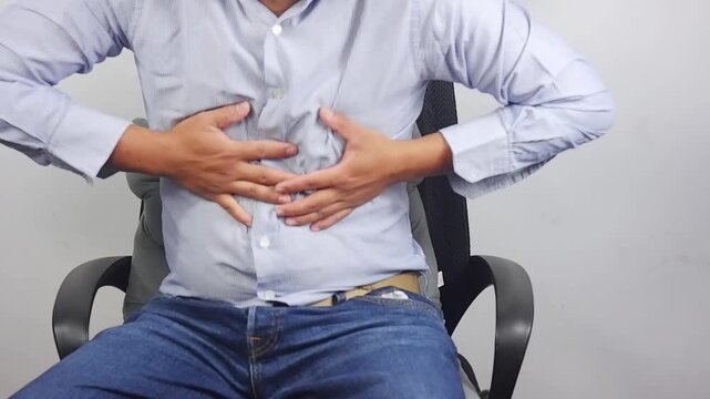 Man holding chest, heart attack, shortness of breath, heart disease, panic attack, health problems at night, stress at home. Emergency conditions. Emergency aid for heart disease
