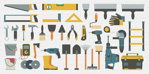 a construction tools set on wooden back