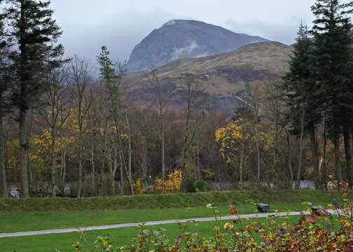 Autumn weather on Ben Nevis, Fort William, Lochaber, Scottish Highlands. Showing the Carn Dearg buttress and the North Face under cloud, Meall an t-Suidhe and colourful autumn foliage.