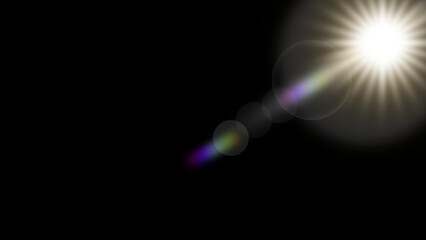 Bright sunburst lens flare with rainbow colors on black background isolated on transparent background