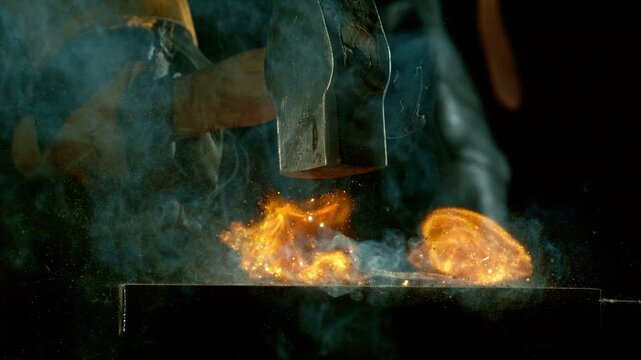 Cinematic close-up of blacksmith forging glowing hot iron on anvil with sparks flying. Shot in dramatic lighting on dark background with high-speed camera at 1000fps.
