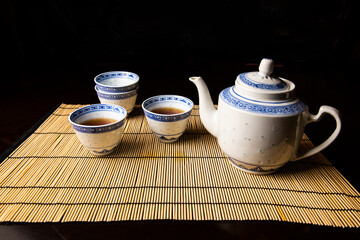 Chinese tea set with teapot and cups on table