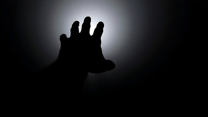 Obraz premium forearm. Silhouetted forearm reaching toward a light source against a dark gradient background. wellbeing guides, coaching materials, designed for mental health education and mindfulness programs.