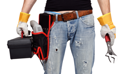 A mechanical engineer stands in gloves, drill, wrench and toolbox