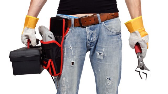 A mechanical engineer stands in gloves, drill, wrench and toolbox - Powered by Adobe