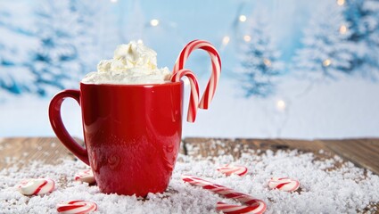 Red mug hot chocolate with candy canes and snow peppermint