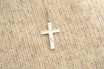 The cross-shaped necklace is a perfectly designed accessory.