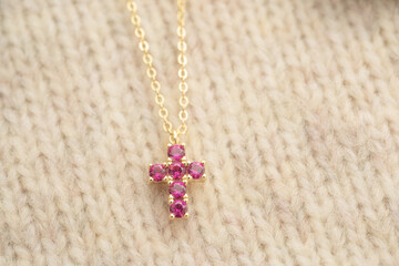 The cross-shaped necklace is a perfectly designed accessory.