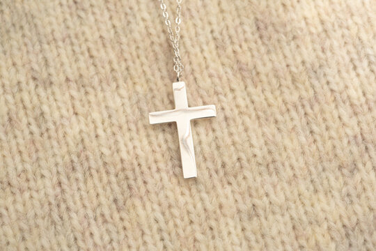 The cross-shaped necklace is a perfectly designed accessory.