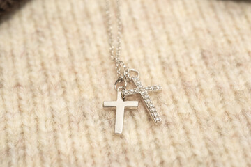 The cross-shaped necklace is a perfectly designed accessory.