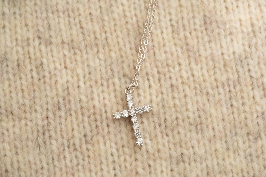 The cross-shaped necklace is a perfectly designed accessory.