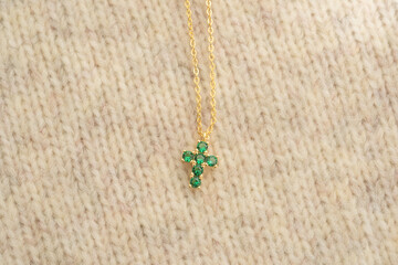The cross-shaped necklace is a perfectly designed accessory.