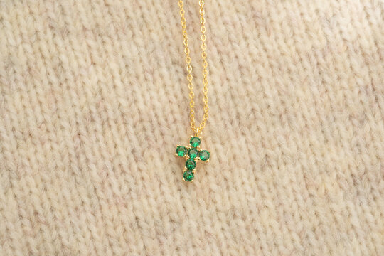 The cross-shaped necklace is a perfectly designed accessory.