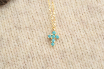 The cross-shaped necklace is a perfectly designed accessory.