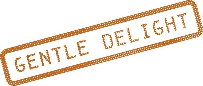 A brown dotted rubber stamp with the words gentle delight embossed