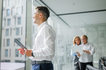 Team members discussing ideas in a modern office setting