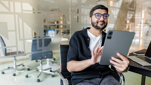 Man using tablet in modern office setting