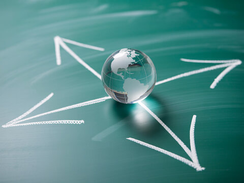 Navigate global business strategies with a clear direction and worldwide vision using this crystal globe and arrow concept for success and planning ahead