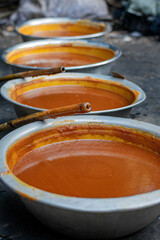 Traditional Production: Date Palm Molasses Lined Up for Solidification