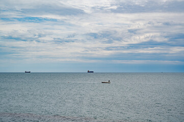 Calm sea with a distant boat