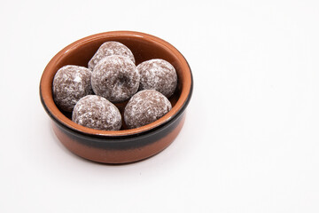 Chocolate truffles in small earthenware dish