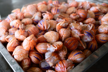 Fresh seafood tails in a metallic tray