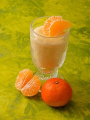 Vanilla pudding in glass with tangerine