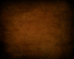 Rustic textured background with warm brown and orange tones evoking a sense of age and natural material for design