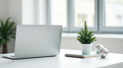 Laptop and Mini Christmas Tree on a Desk computer office