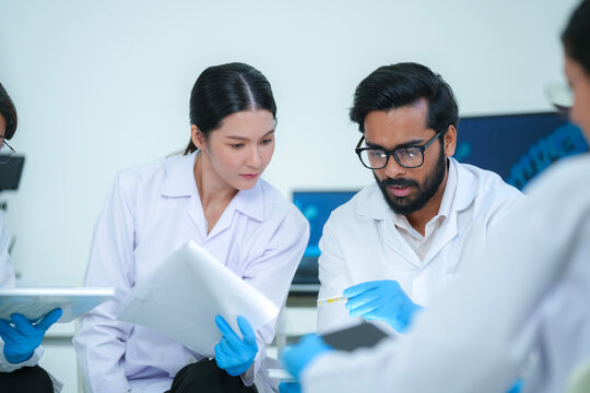 Biotech research group utilizing AI algorithms on tablet for genomic data analysis and accelerated drug discovery solutions.