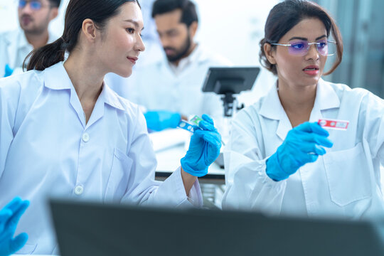 Biotech research group utilizing AI algorithms on tablet for genomic data analysis and accelerated drug discovery solutions.