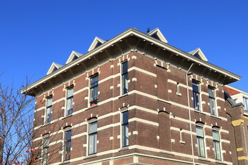 Amsterdam Westerstraat and Lijnbaansgracht Street Brick Corner Building with Blue Sky, Netherlands