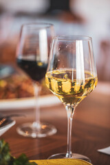Two glasses of wine served at a modern upscale food restaurant and bar 