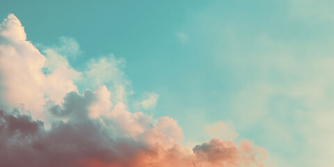 Dreamy pastel sky with soft clouds in warm orange and turquoise gradient, calm and inspiring minimal landscape background
