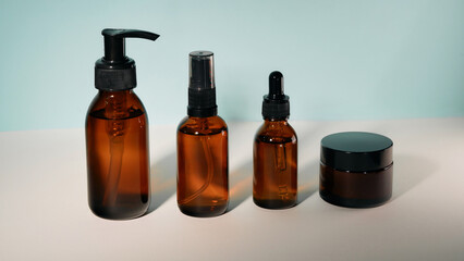 transparent jars for cosmetics on a light background