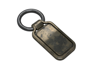 Antique brass rectangular keychain with metal ring, isolated on black background.
