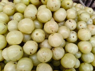 Close up shot of pile of fresh Indian gooseberry. 