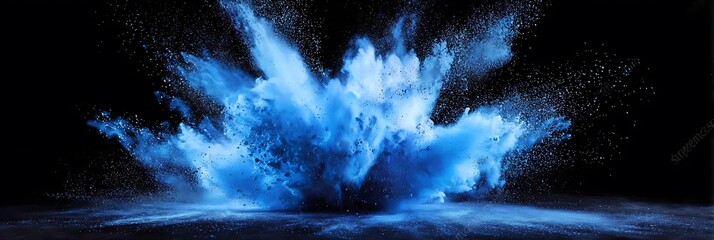 Captivating explosion of vibrant blue powder against a stark black backdrop creating a dynamic and abstract visual spectacle with a modern style.