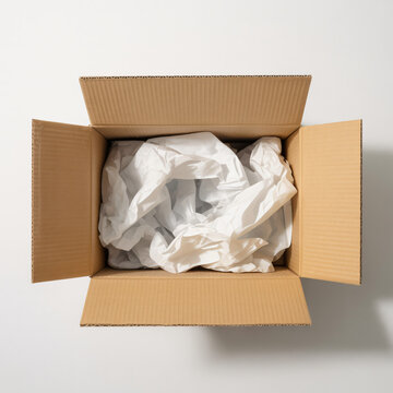 Open shipping carton box with paper filler inside isolated for e commerce packaging and logistics mockup