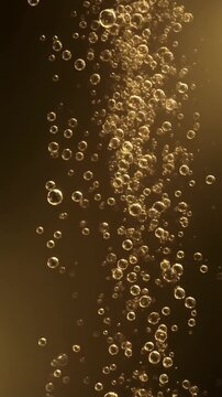 Elegant champagne bubbles rising in golden light