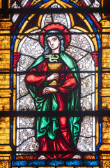 Fototapeta premium Stained glass (19th century) of Saint John the evangelist. Saint of the Roman Catholic Church.