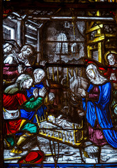 Stained glass (19th century) of Christmas Nativity Scene with Virgin Mary, Saint Joseph, and Jesus baby.