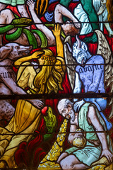 Stained glass (19th century) of Vision of hell and demons tormenting souls.