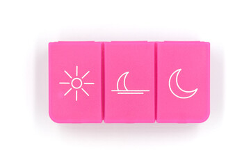 A pill organizer with compartments on a white background. A pillbox for daily medications for maintaining good health.