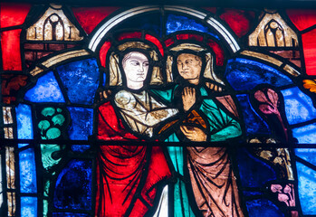 Fototapeta premium Stained glass (19th century) of Visitation of the Virgin Mary to her pregnant cousin Elizabeth.