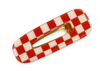 Hair clip featuring red and white checkerboard pattern, a stylish fashion accessory for hair styling and retro looks