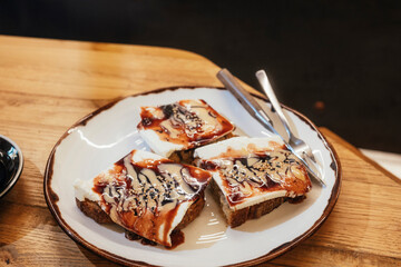 Close-up of toast slices with sauces.