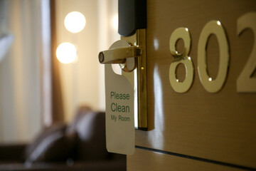 Hotel door privacy hanger. Enjoying my room tag hanging in the door knob.	